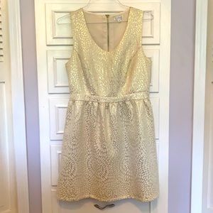 Gold and white shimmer dress.